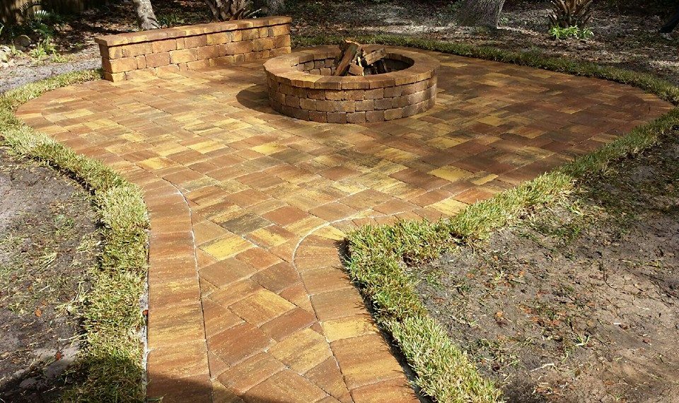 Finished paver patio with a built-in fire pit, a recent S&D Construction and Maintenance project in Palm Coast, FL